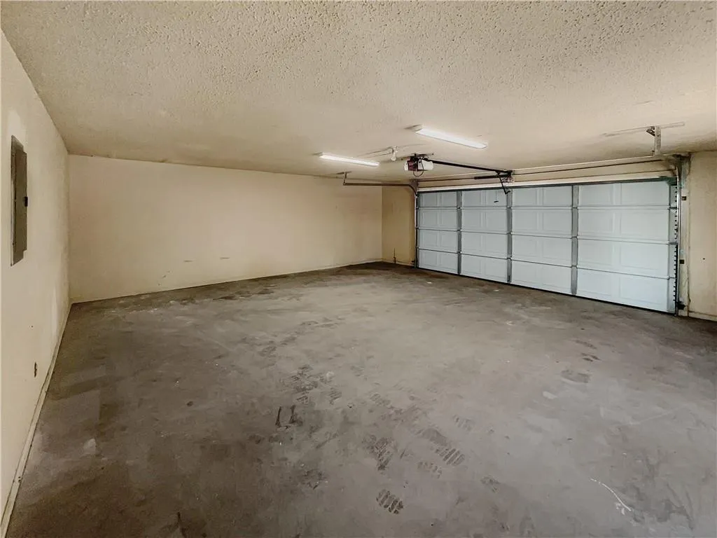Garage featuring electric panel