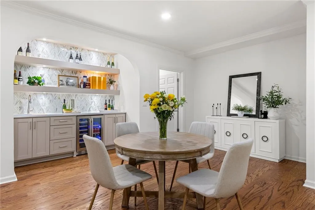 Enjoy endless entertainment in the basement, complete with a custom bar and seamless access to the paver patio for indoor-outdoor living. Perfect for movie nights or gatherings, this space is also plumbed for a second kitchen, offering added versatility.