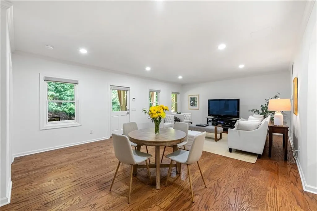 The basement is filled with natural light streaming through Pella windows, offering exceptional versatility to create multiple living environments and an effortless transition from indoor entertaining to the paver patio outdoors.