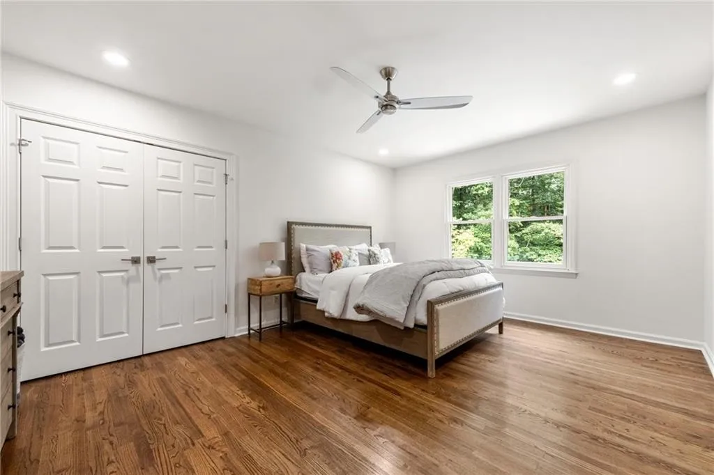 Spacious upper-level secondary bedroom, part of a convenient Jack-and-Jill layout, featuring ample natural light and versatile space ideal for family or guests. Views overlooking the private backyard. Preview all secondary bedrooms and their size by viewing the floor plans associated with the upper level.
