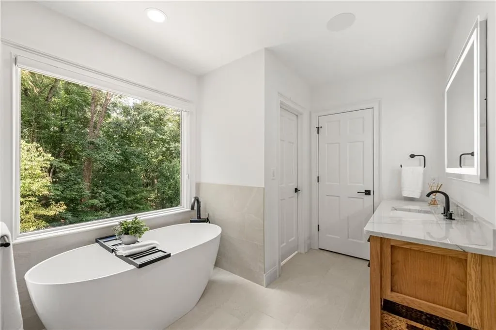Not photographed, but the water closet features a Toto Washlet system, providing a customizable experience with advanced cleansing, heated seating, and personalized comfort for a truly luxurious touch.