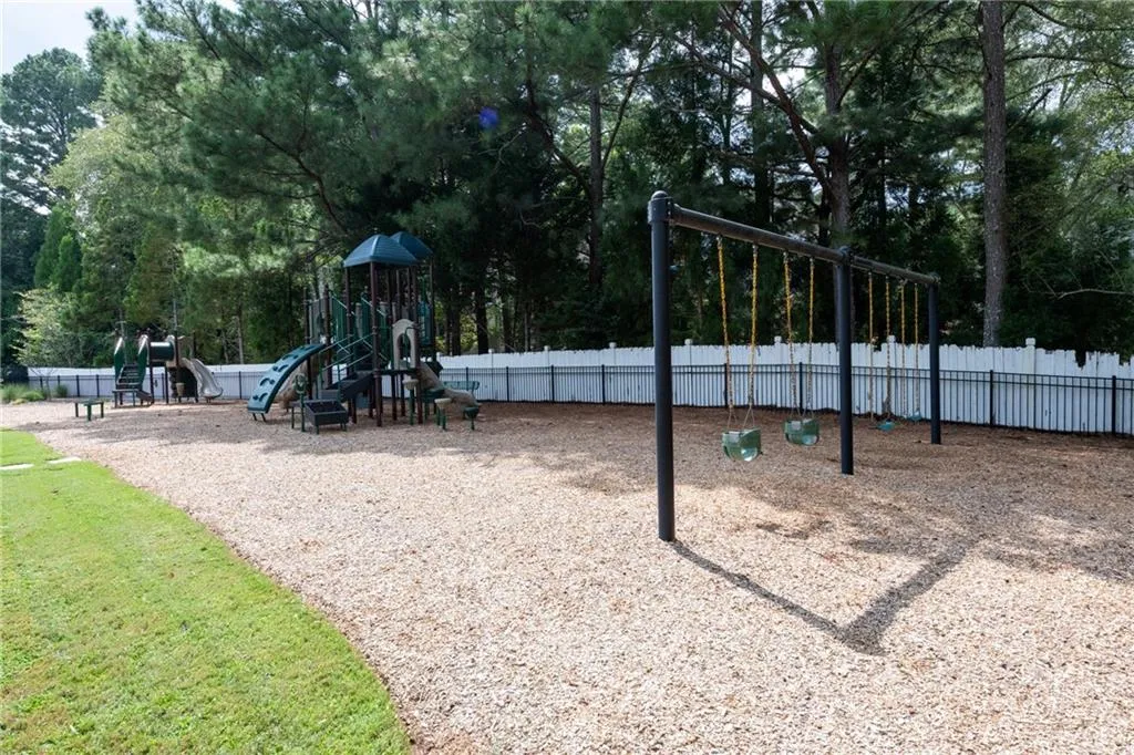 Part of the new gated playground adjacent to the pool and clubhouse.