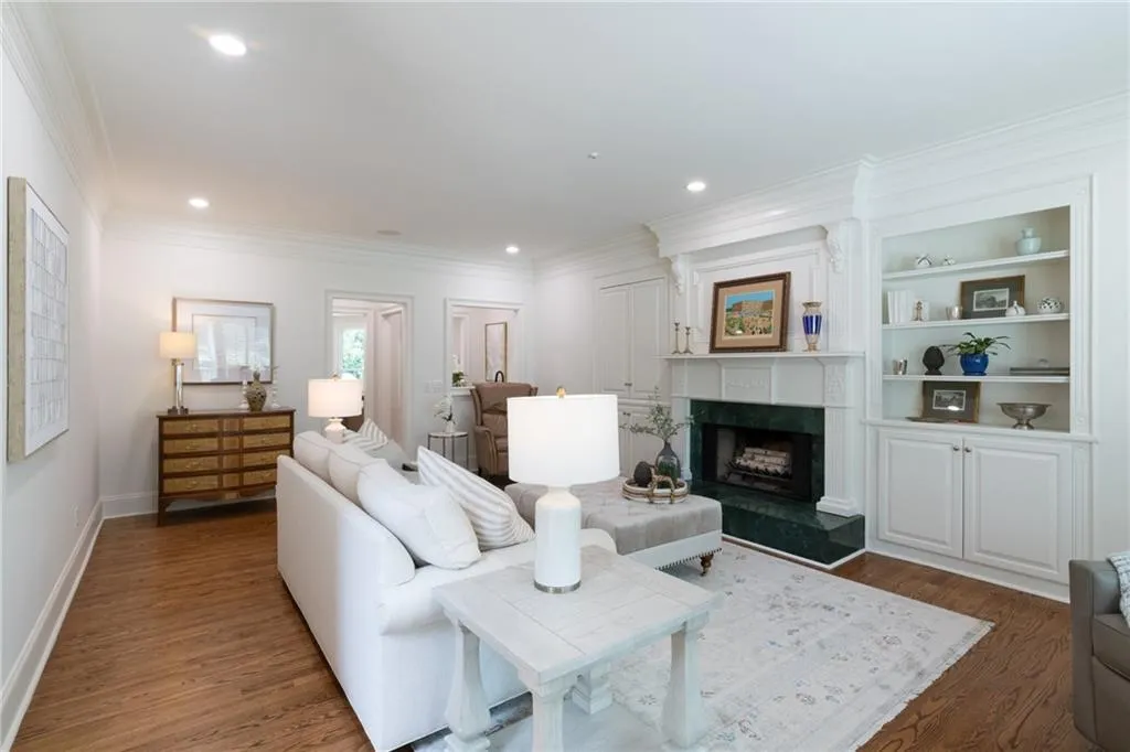Spacious family room featuring elegant carpentry, detailed millwork, and oversized base moulding, creating a refined yet comfortable setting for gathering and relaxation.