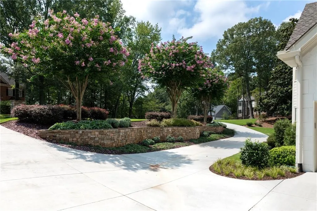 The combination of Crepe Myrtles, lavender, and lamb's ear creates a beautiful, low-maintenance, and pollinator-friendly landscape.