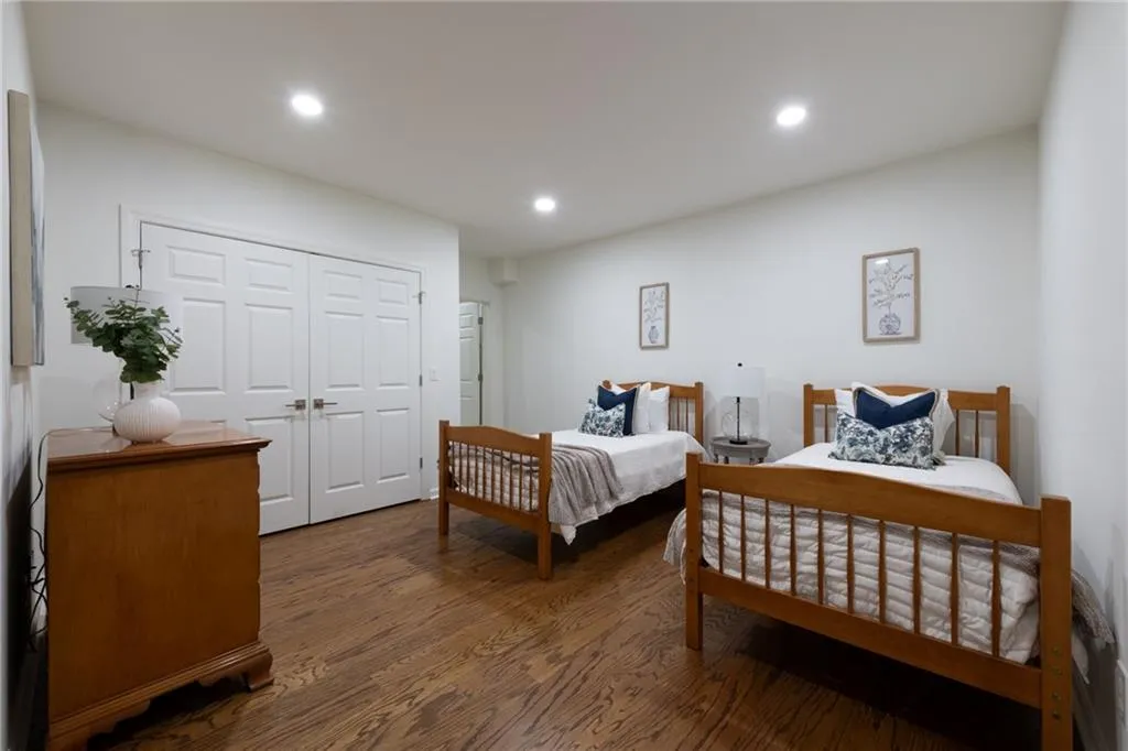 Basement level large bedroom can accommodate any size bed and furniture. Large double door closet with Elfa Shelving system.