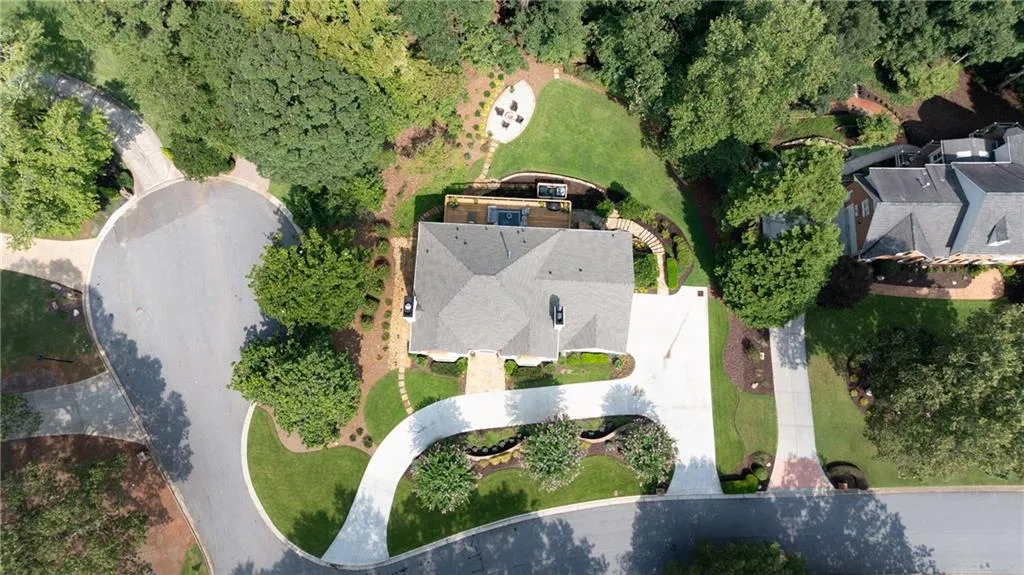 Aerial view of home and property. Home is situated on a .6 acre private lot on the corner of a quiet cul-de-sac.