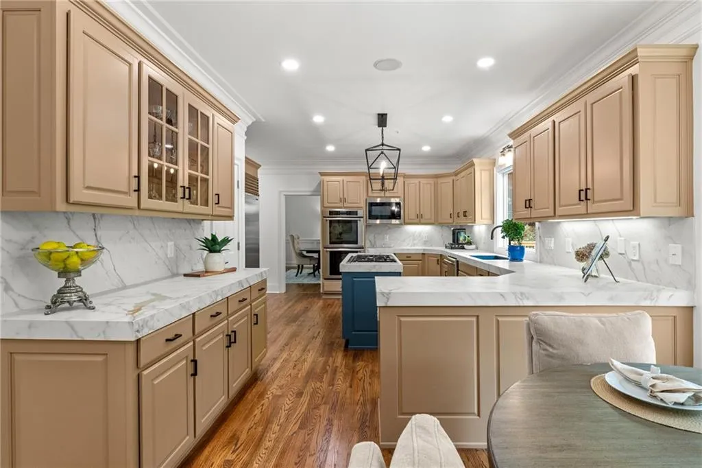 VView from breakfast area to kitchen. Open door in the background leads to formal dining room.