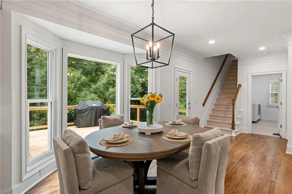 Breakfast area with view towards laundry room #1 and backstairs to bedrooms|office|flex room. Excellent view of the private backyard.