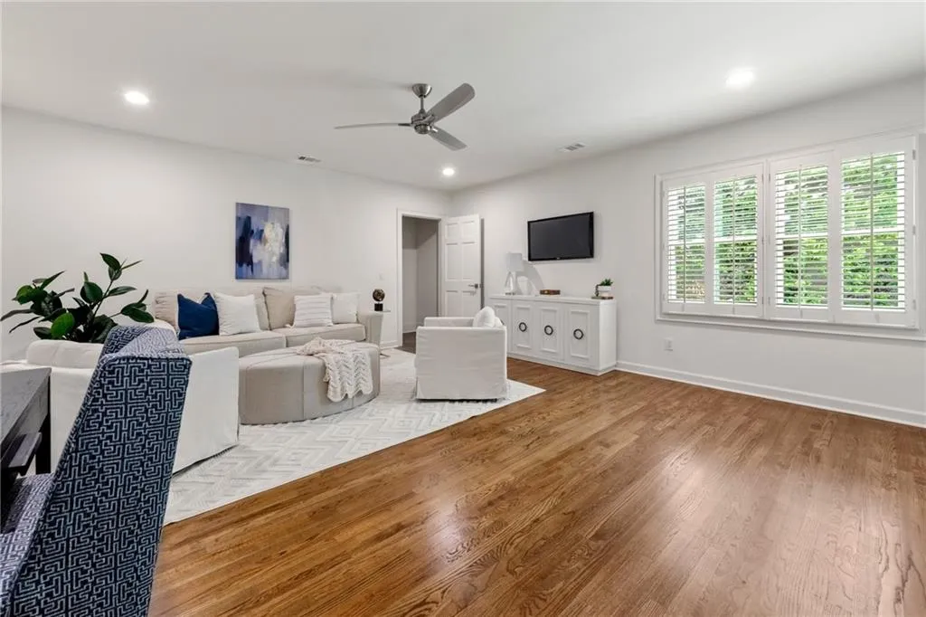 This upper-level 5th bedroom| gaming room | home office has plenty of space for additional casual or office furniture.