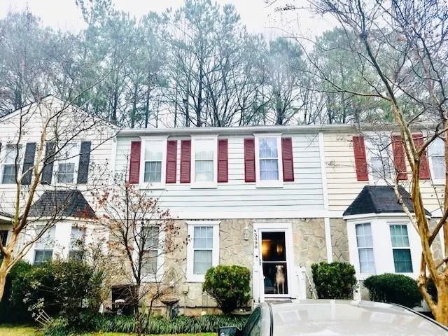 White siding exterior with stone accent facade