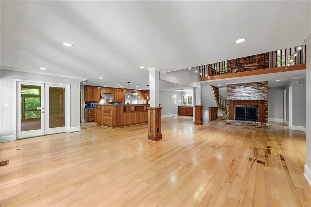 Dining area, view to living room and kitchen and door to screened deck