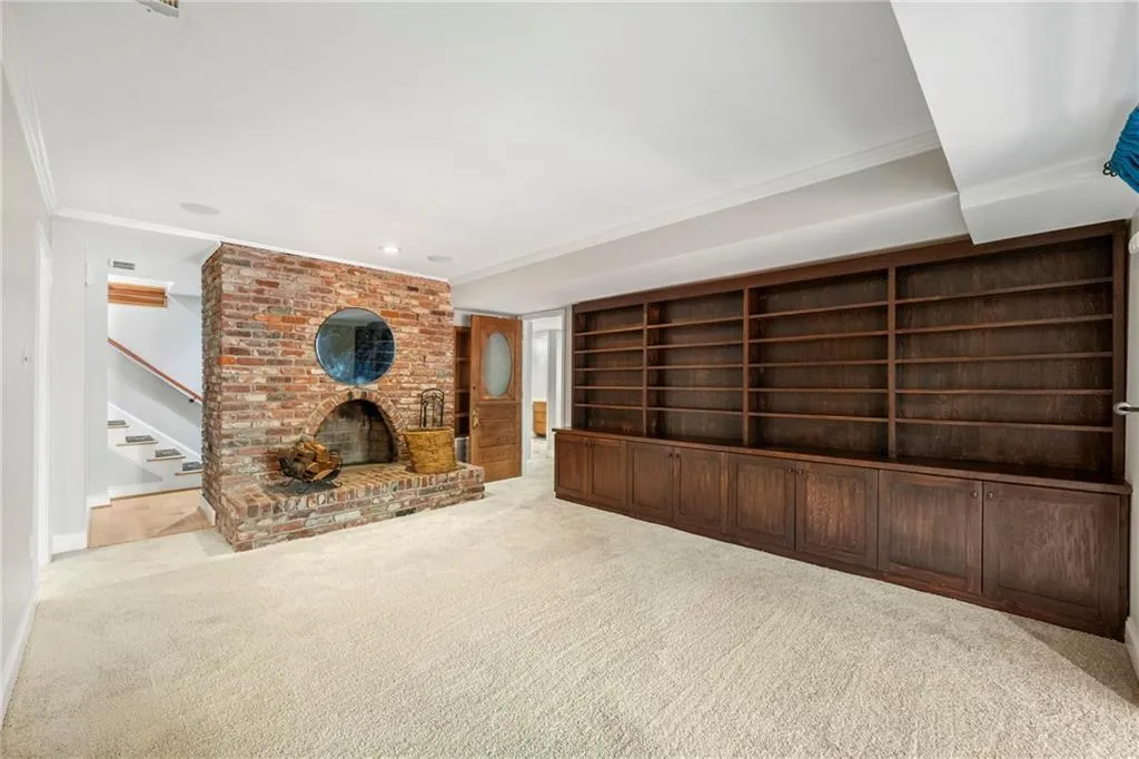 Fabulous brick fireplace with wall of built in bookcases
