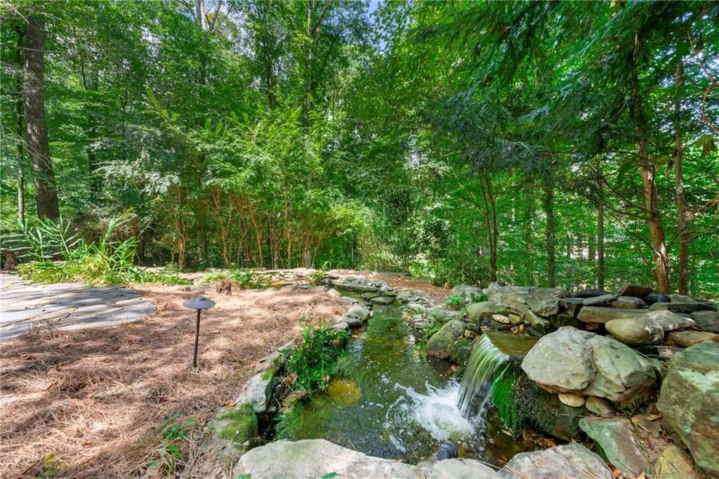 Water feature in backyard with waterfall