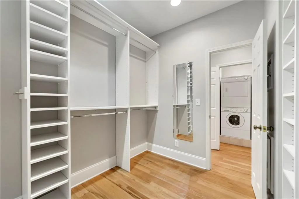 Primary walk in closet and primary laundry closet