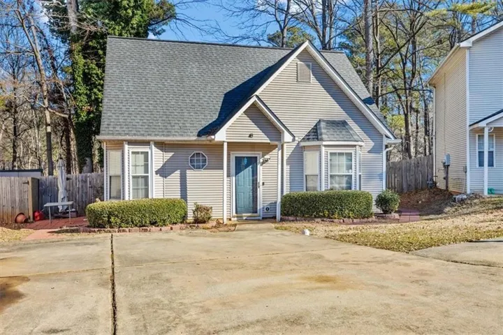 View of front of house featuring roof with shingles