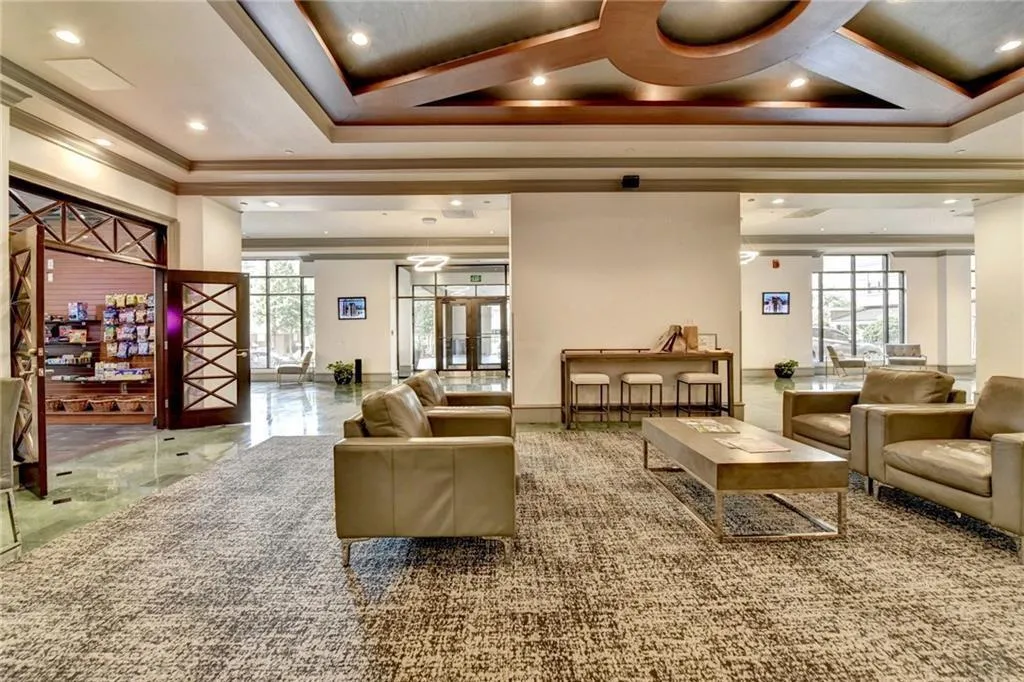 Common area with recessed lighting and crown molding