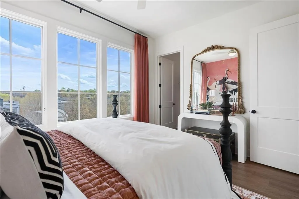 Bedroom featuring wood finished floors and a ceiling fan