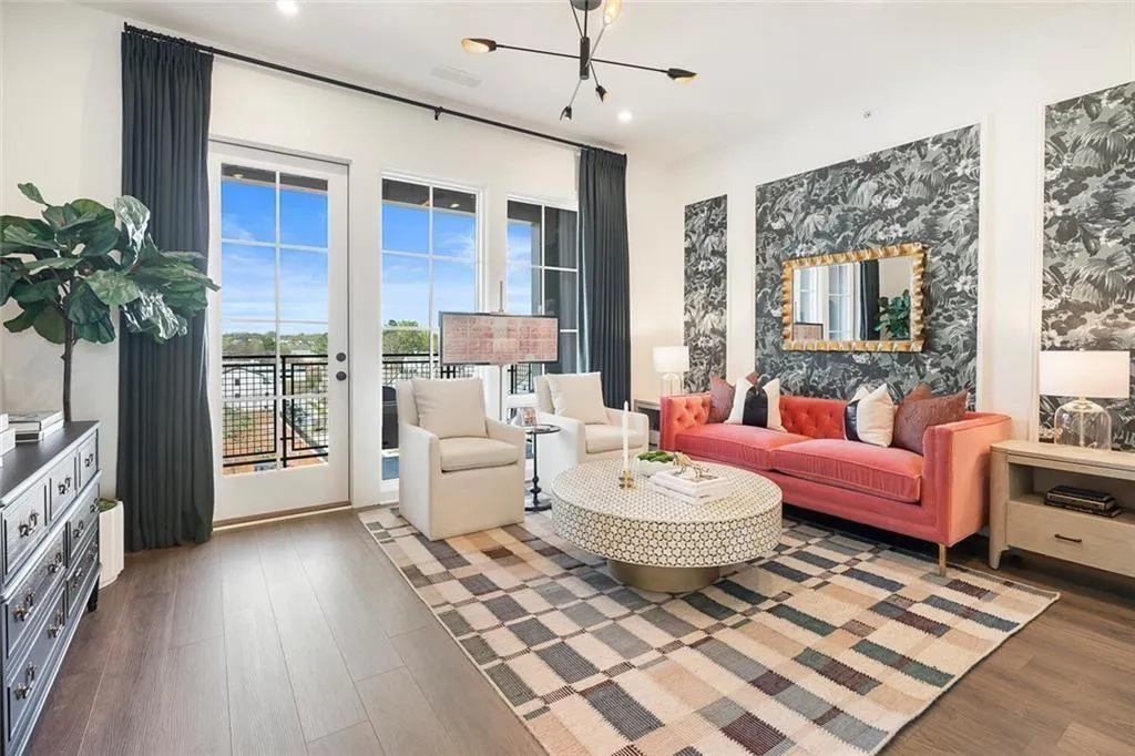 Living area featuring wood finished floors, a chandelier, and recessed lighting