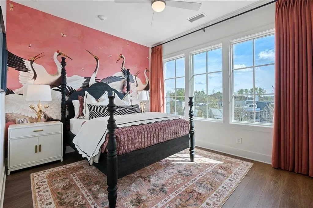 Bedroom with wood finished floors and ceiling fan