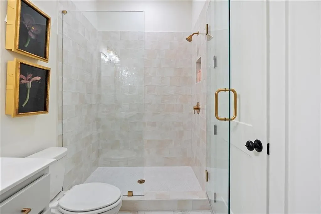 Bathroom with a shower stall and vanity