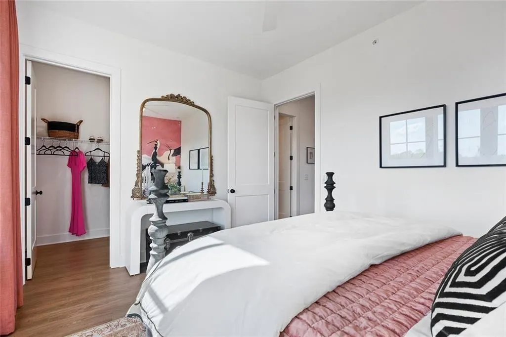 Bedroom featuring wood finished floors and a ceiling fan