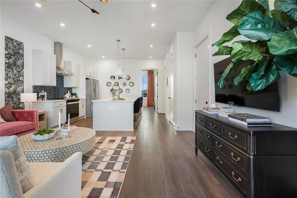 Living room featuring wood finished floors and recessed lighting
