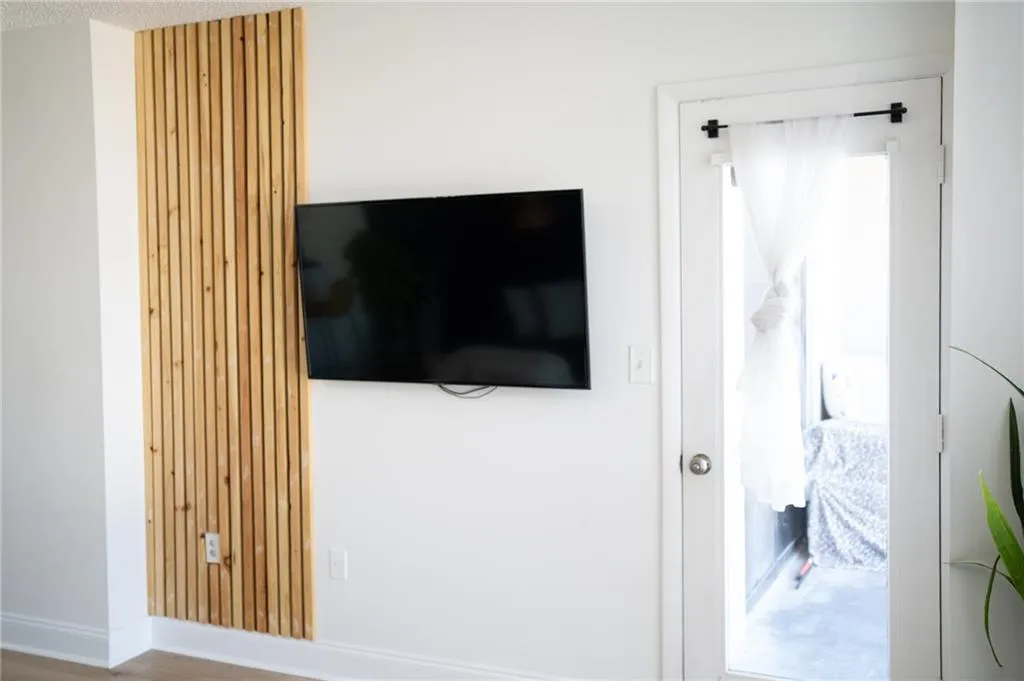 Detailed view of baseboards and wood finished floors