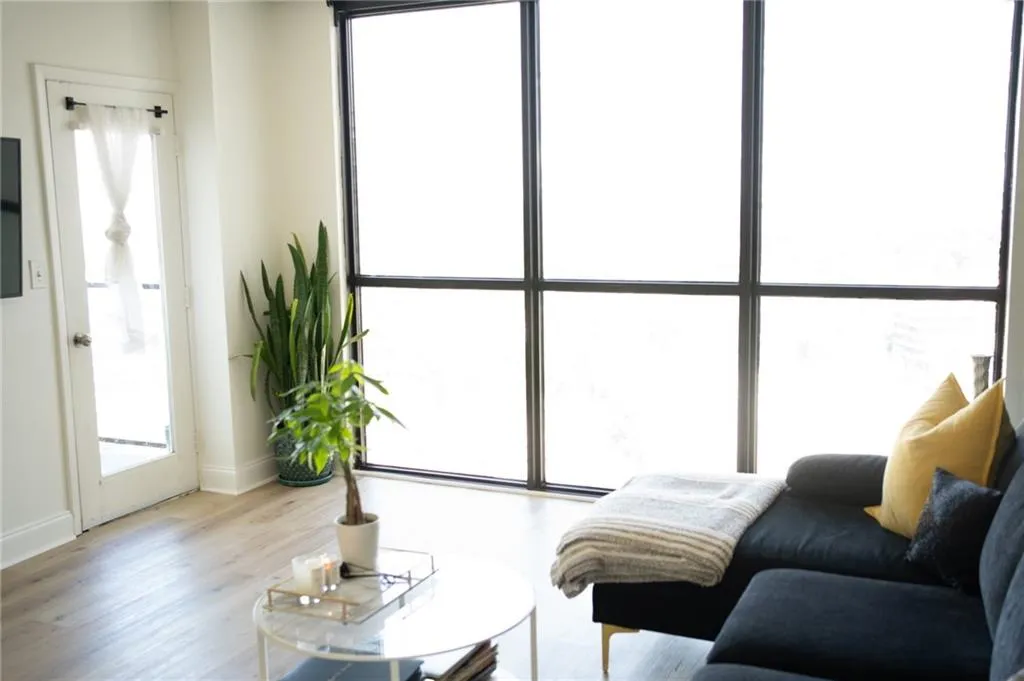 Sitting room featuring light wood finished floors and baseboards