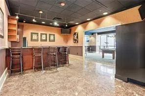 Community bar area featuring open shelves