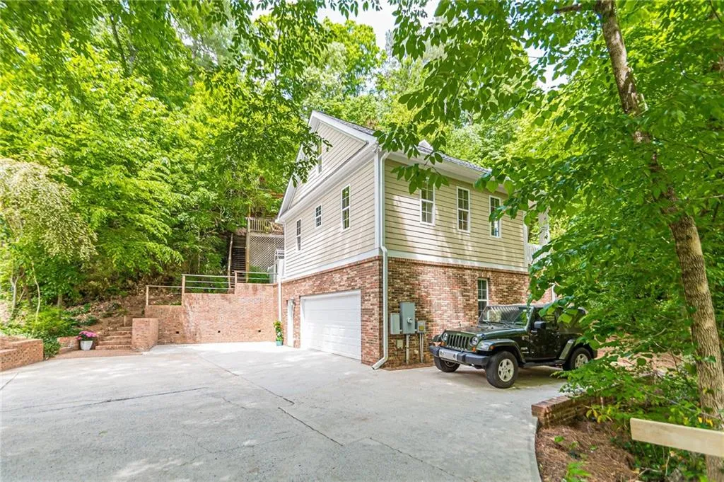 View of side of property featuring a garage