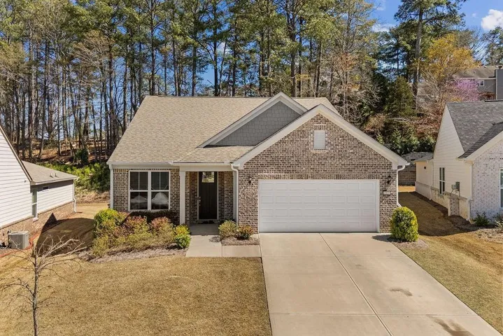 Brick and siding exterior with a two-car garage