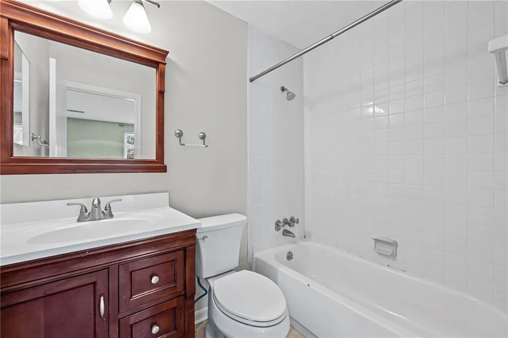 Full bathroom featuring shower / tub combination and vanity