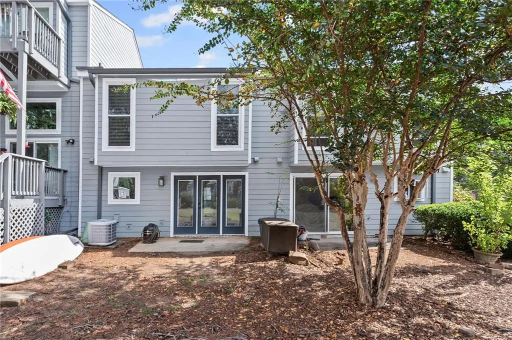 Rear view of property with a patio area