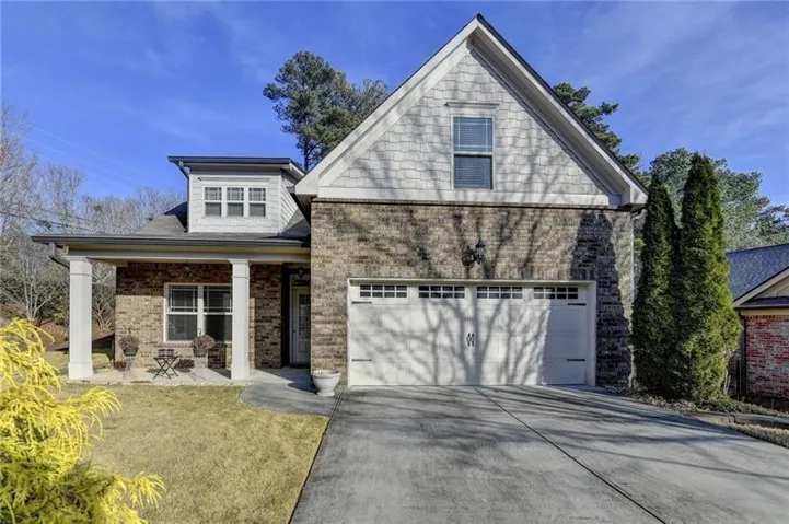 Brick exterior with shingle siding accents
