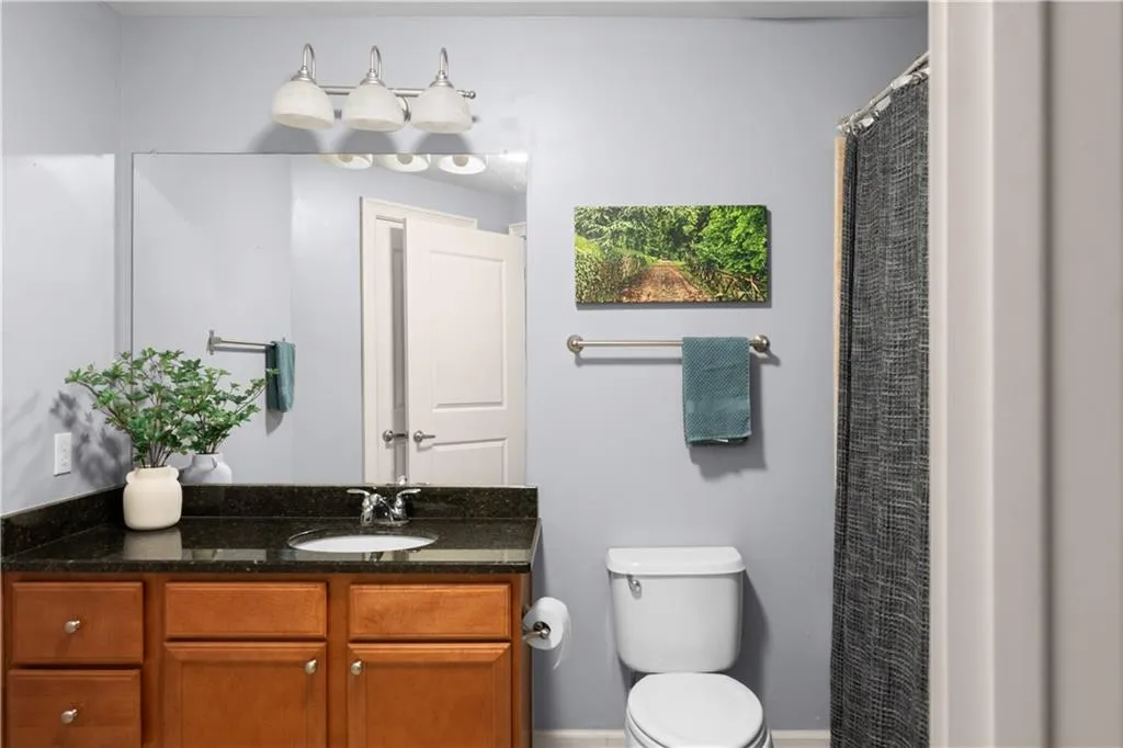 Bathroom featuring vanity and a shower with curtain