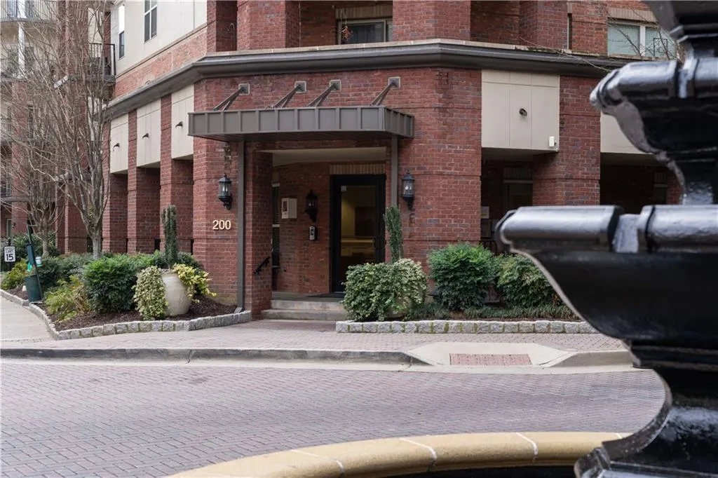 View of exterior entry with brick siding
