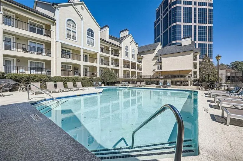 Community pool with a patio area