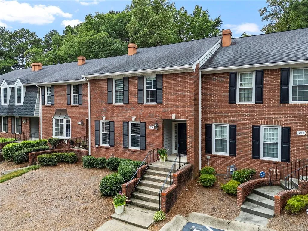 This charming Colonial all brick townhome offers spacious living and the ultimate convince!