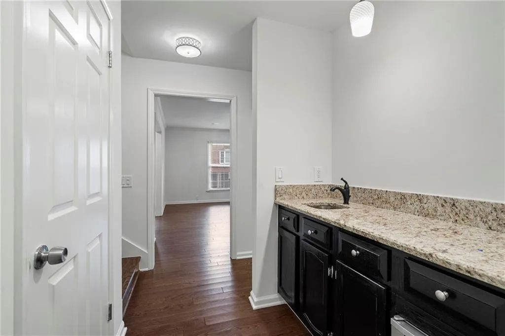 Entraining is even easier with a wet bar off the formal living and into the den