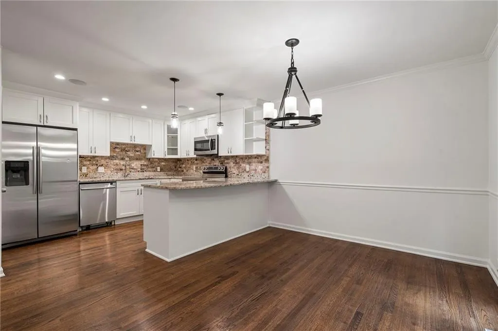 Open to the dining room this large space will delight your guests during dinner parties.