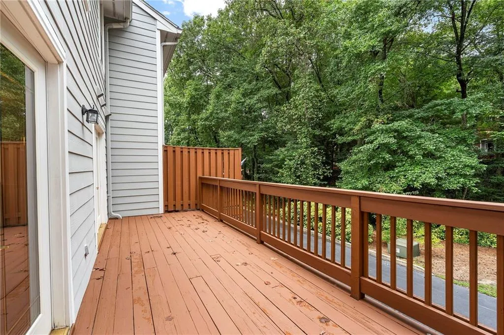 Patio off kitchen and family room overlooks the properties natural area and provides privacy.