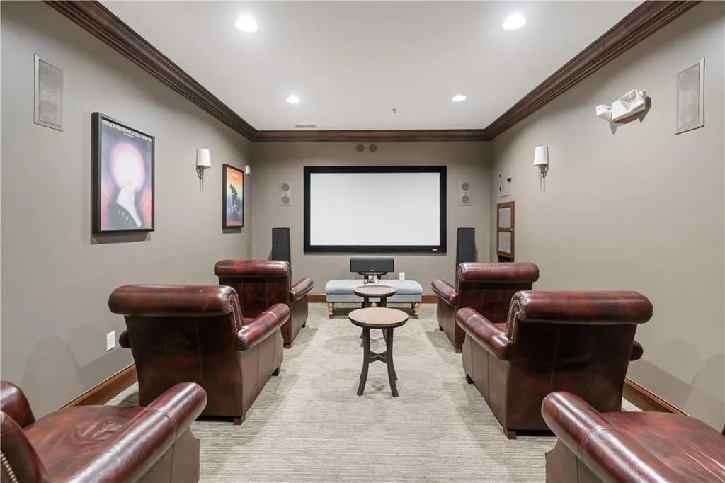 Movie theater with ornamental molding and recessed lighting