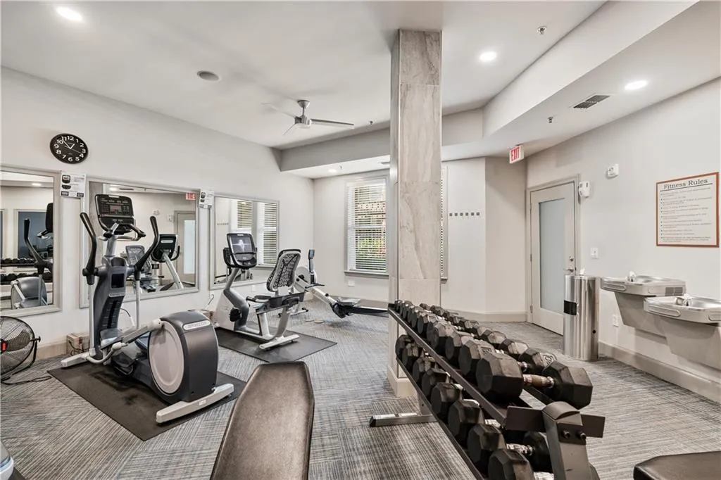 Gym with carpet floors, recessed lighting, and ceiling fan