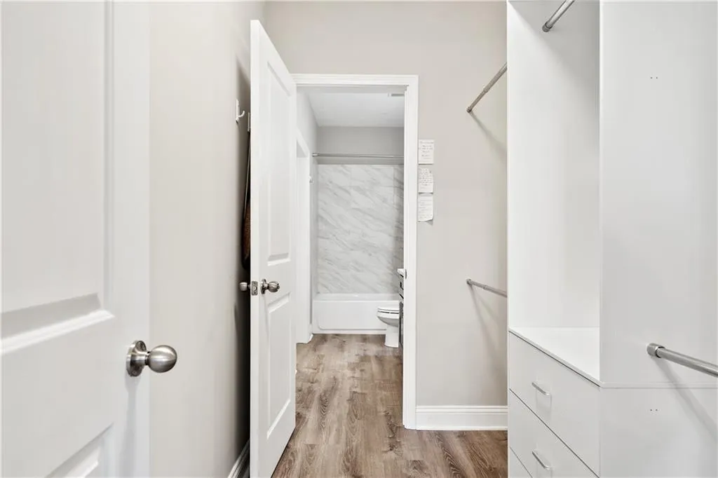 Walk in closet featuring light wood-style floors