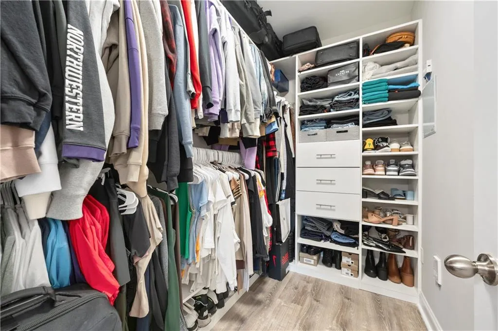 Spacious closet with light wood-style floors