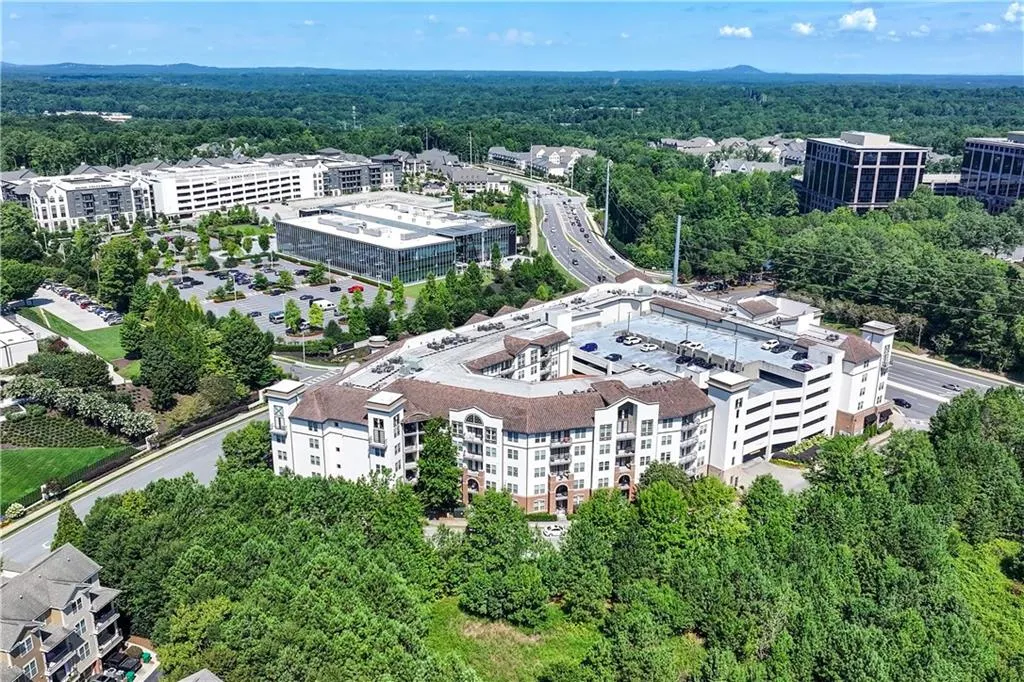 Bird's eye view of a forest and apartment complex / building