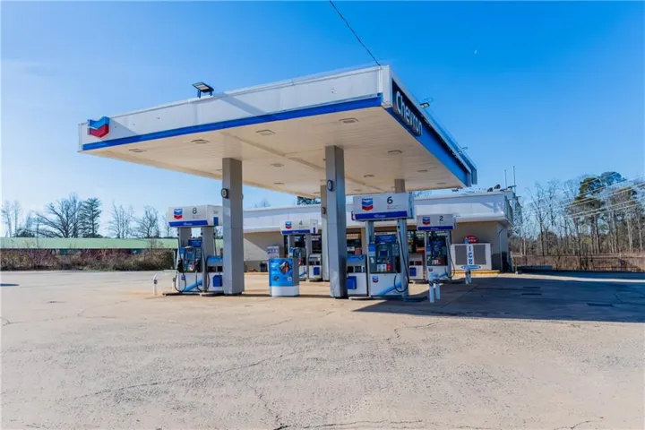 Fueling station canopy with integrated lighting