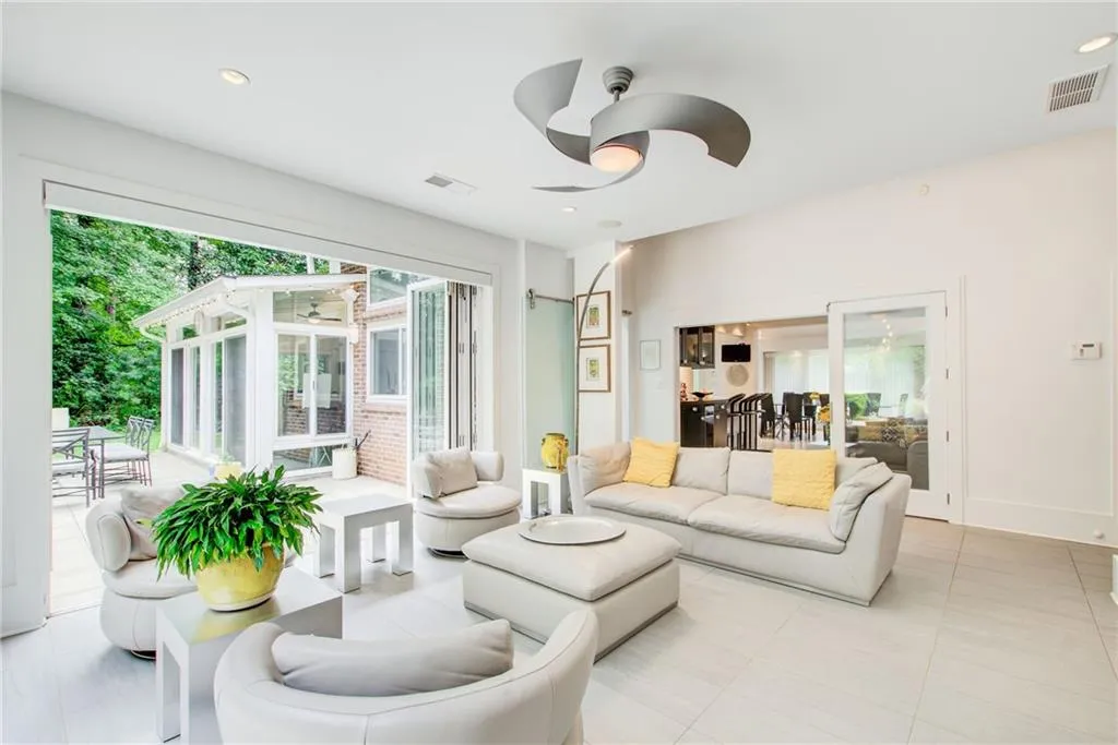 This family room can be closed off from the rest of the house by interior glass doors so that when the room is opened to the patio the rest of the house stays at a comfortable temperature.