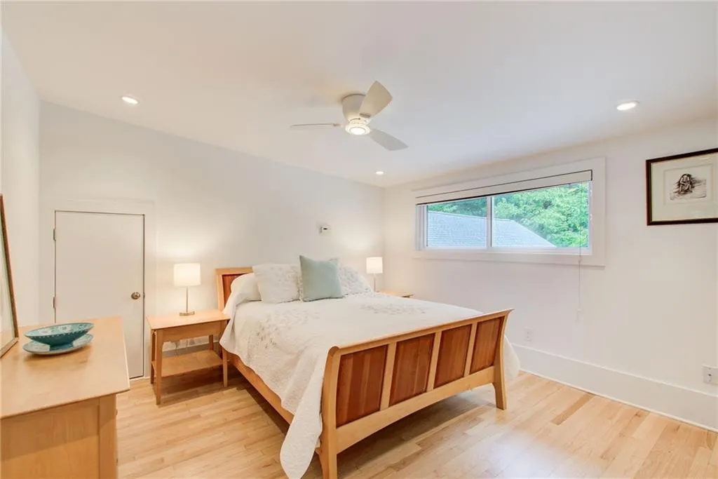Upstairs second bedroom with large closet and walk in attic storage.