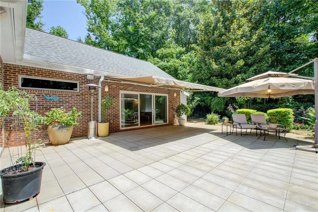 Electric awning off the primary bedroom for shaded al fresco dining
